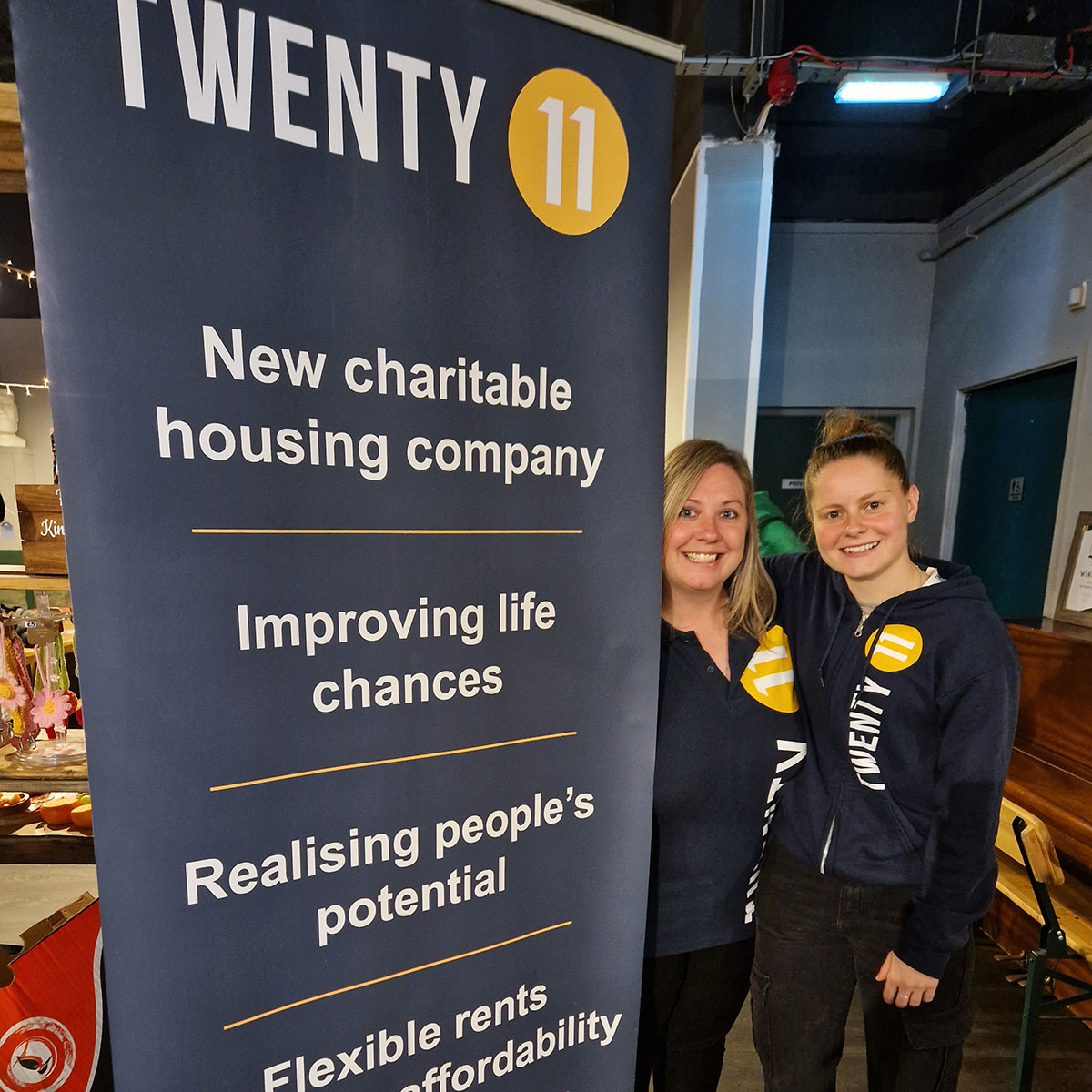 Two Twenty11 Realising Potential Specialists with a display banner